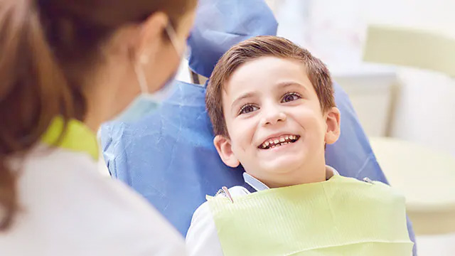 Child smiling while taking treatment.